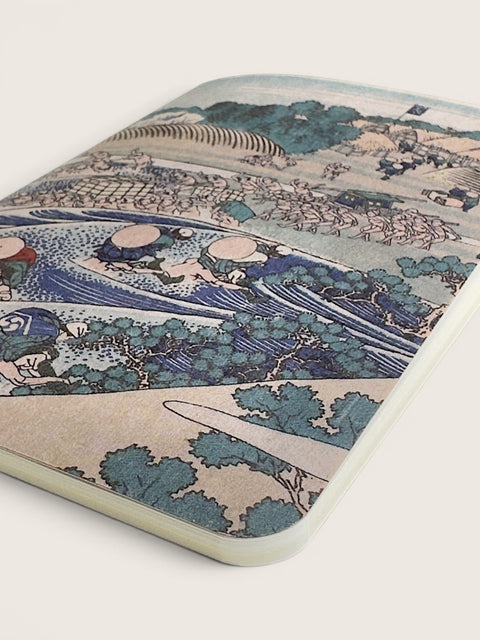 A rectangular mousepad with rounded corners featuring a classic Japanese ukiyo-e woodblock print of a wave scene, shown on a light beige background.
