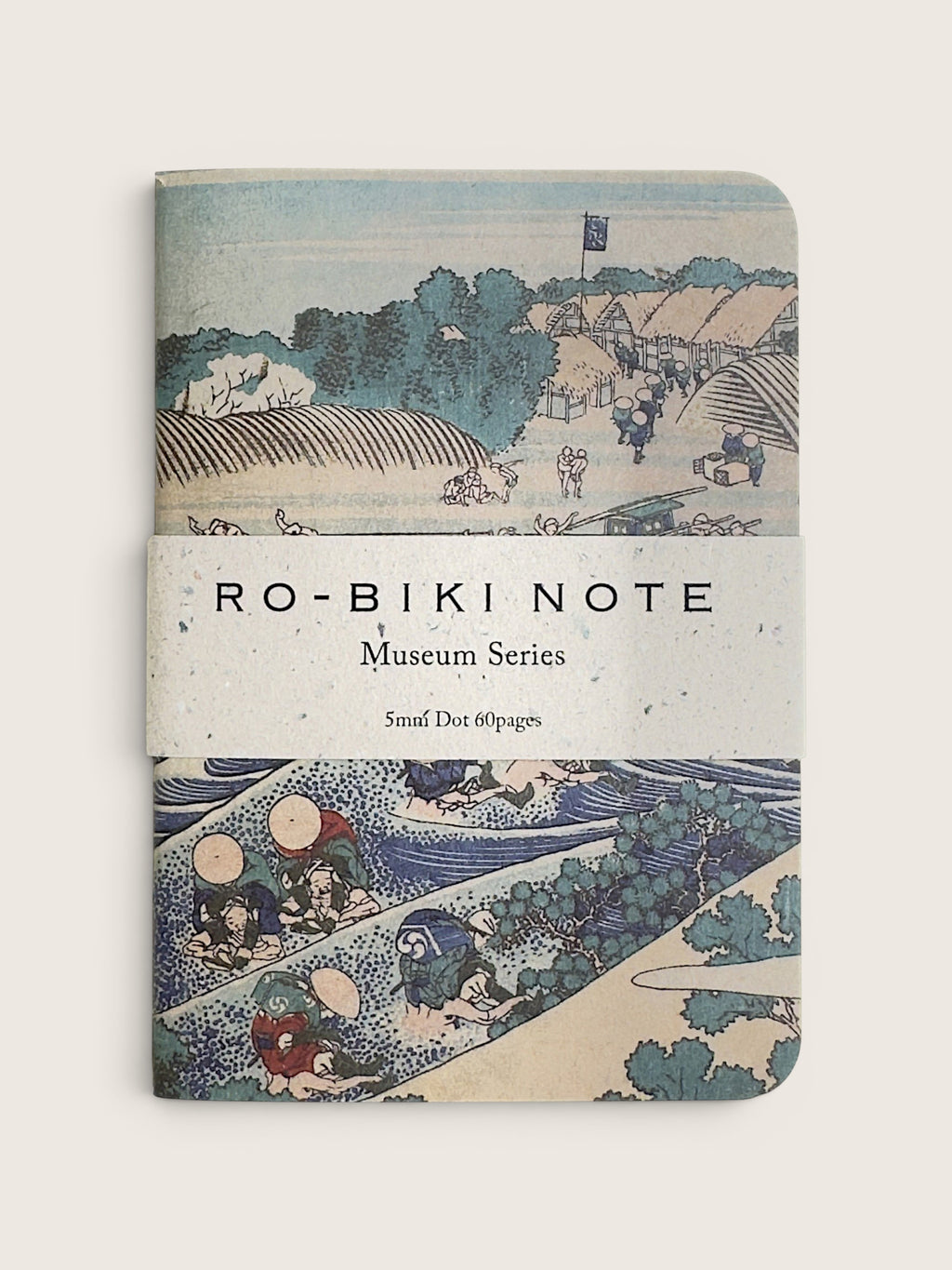 A notebook with a vintage Japanese ukiyo-e woodblock cover design, featuring the text 'RO-BIKI NOTE Museum Series' wrapped around the center, photographed against a neutral light beige background.