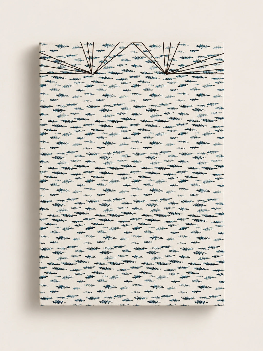 Cream handmade french journal cover printed with a repeating pattern of small dark blue and teal cypress sprigs, with fine black thread stitching fanning across the top edge