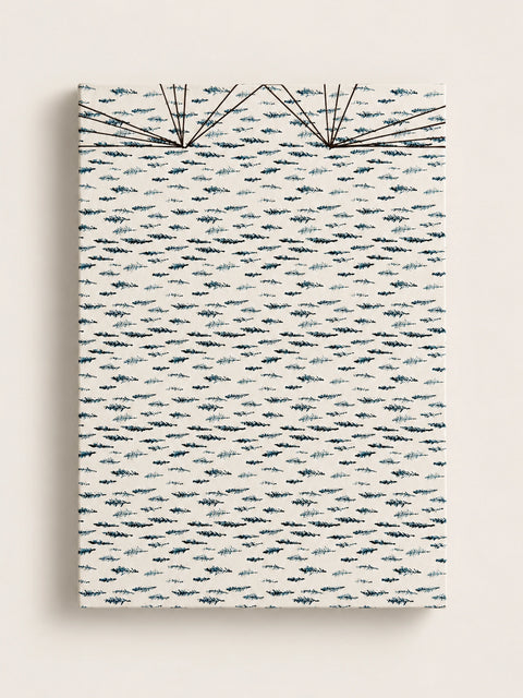 Cream handmade french journal cover printed with a repeating pattern of small dark blue and teal cypress sprigs, with fine black thread stitching fanning across the top edge