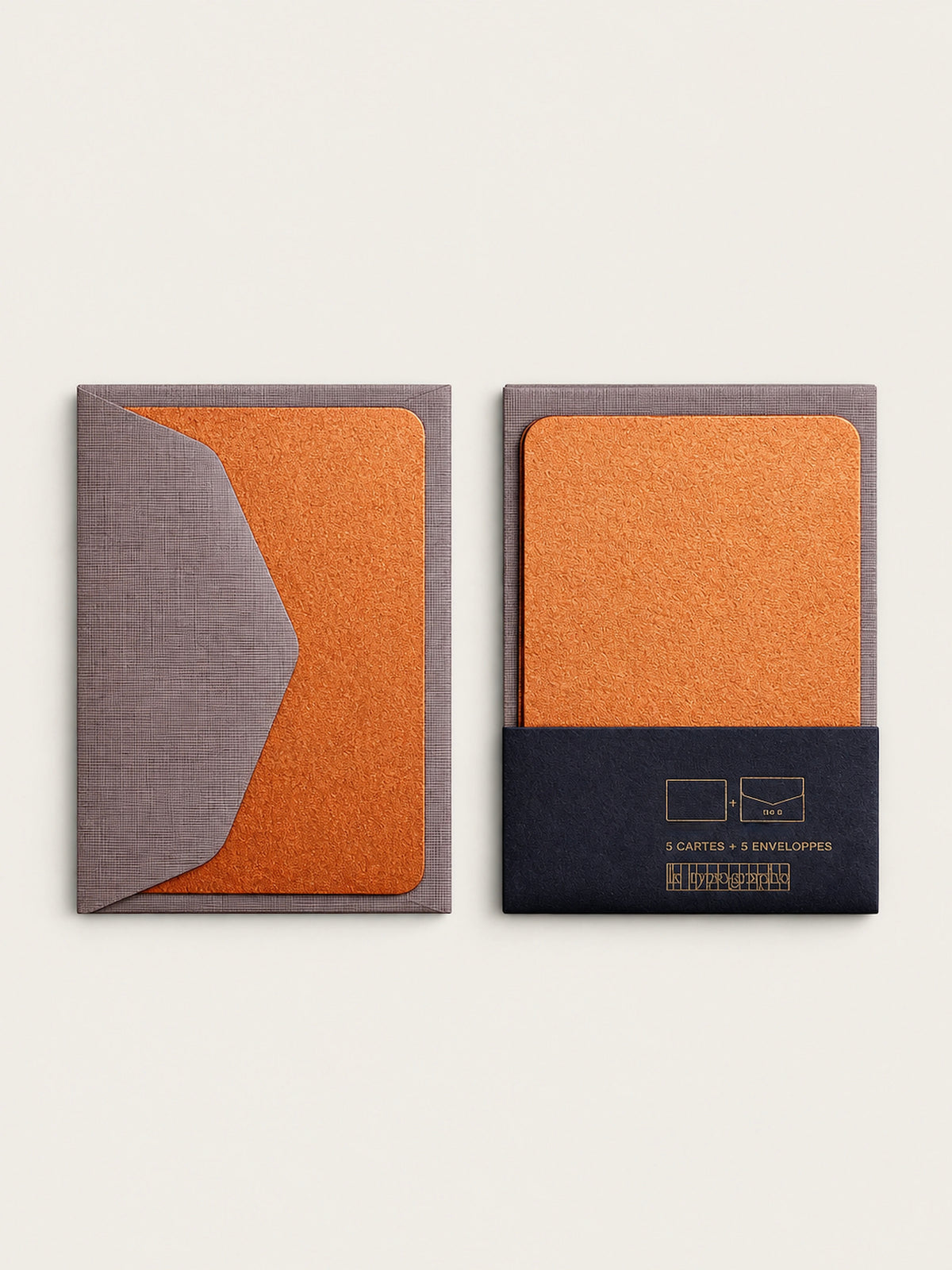 Two copper mini note cards side by side, one behind its barley envelope flap and one in the charcoal band printed 5 cartes and 5 enveloppes.