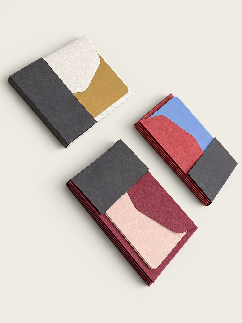 Three Le Typographe mini card and envelope sets in burgundy, blue, mustard and ivory paper