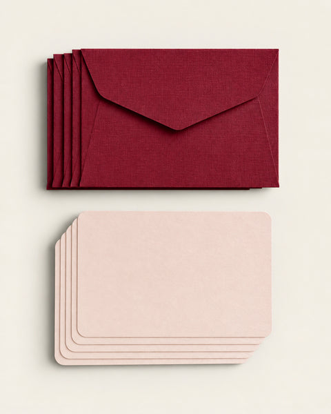 Five burgundy textured envelopes with five pale peach mini cards by Le Typographe