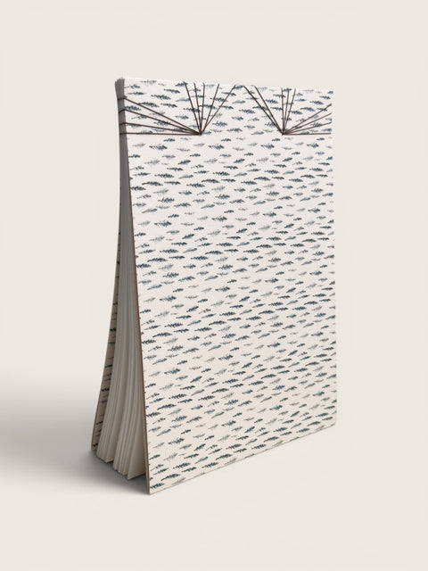 Ourooh A5 notebook featuring a white cover with black cypress sprig pattern and decorative Japanese-style fan binding.