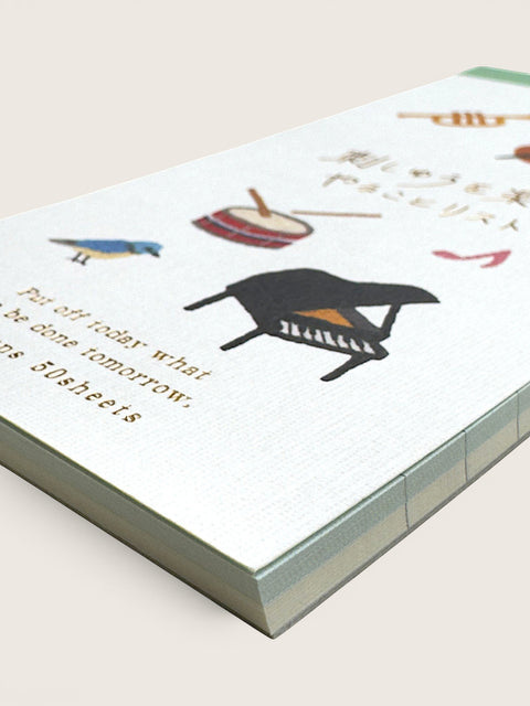 Ourooh Japanese music-themed to-do list pad with illustrated instruments, a blue bird, and gold text on white paper.