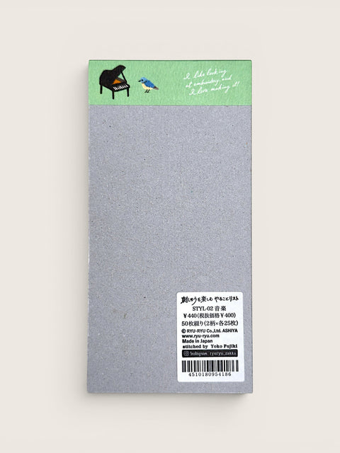 Ourooh Japanese to-do list pad featuring embroidered musical instrument illustrations and a blue bird on a green header.