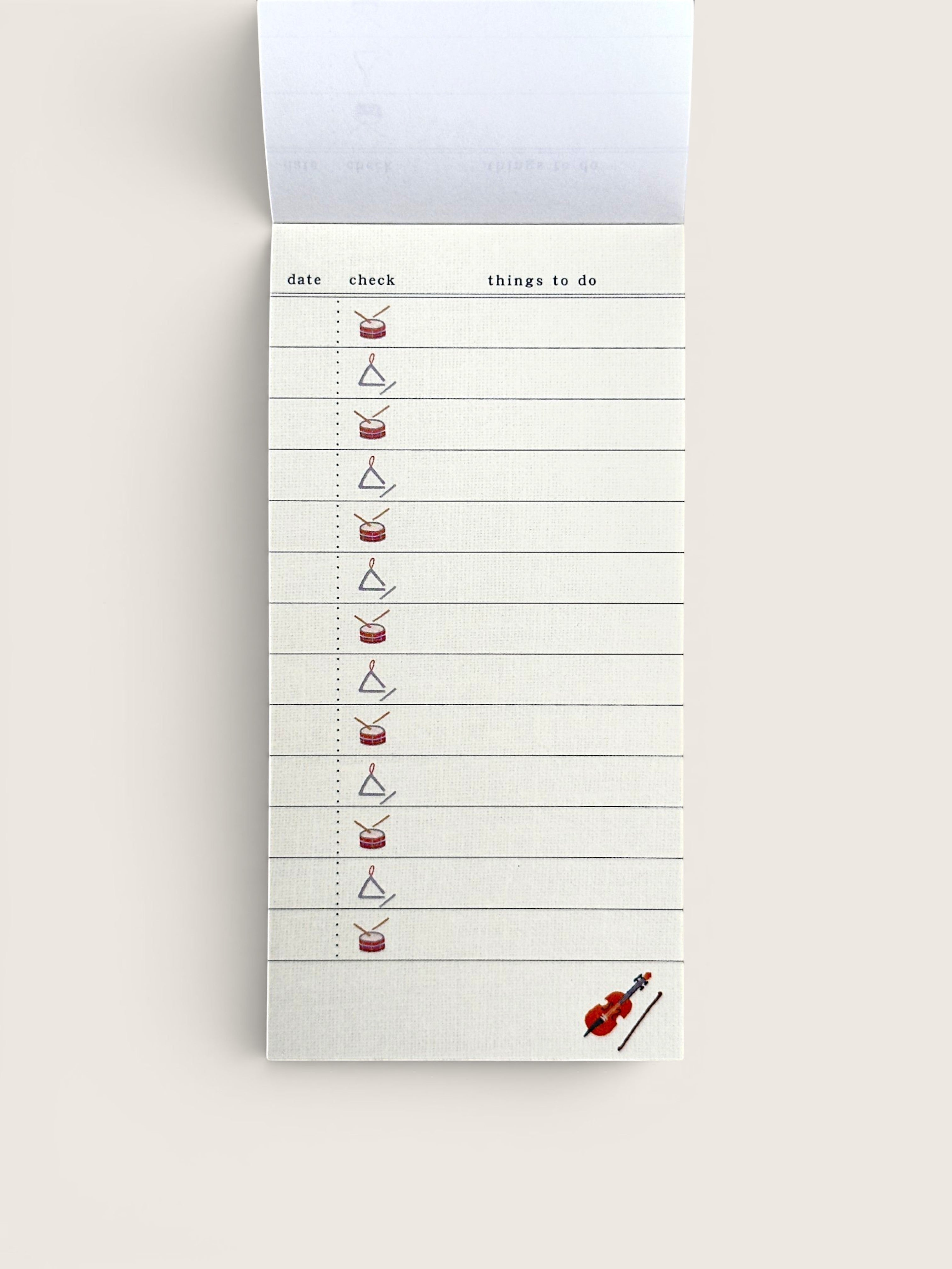 Ourooh Japanese to-do list pad featuring musical instrument illustrations, green top binding, and cream paper.