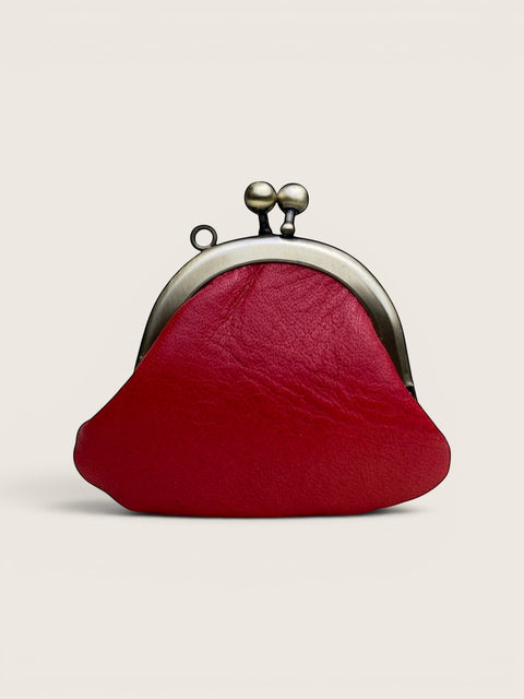 Ourooh Japanese leather necklace purse in red with a rounded gamaguchi clasp and antique brass hardware.