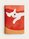 Front cover of the White Cat A5 notebook, mula’s illustration of a white cat stretched across textured red and orange, by RYU-RYU
